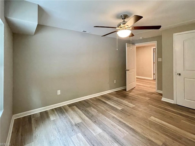 unfurnished bedroom with wood-type flooring and ceiling fan