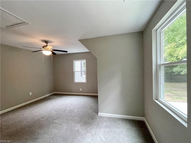 additional living space with carpet and ceiling fan