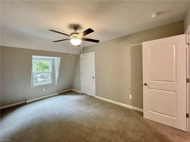 empty room featuring carpet flooring and ceiling fan