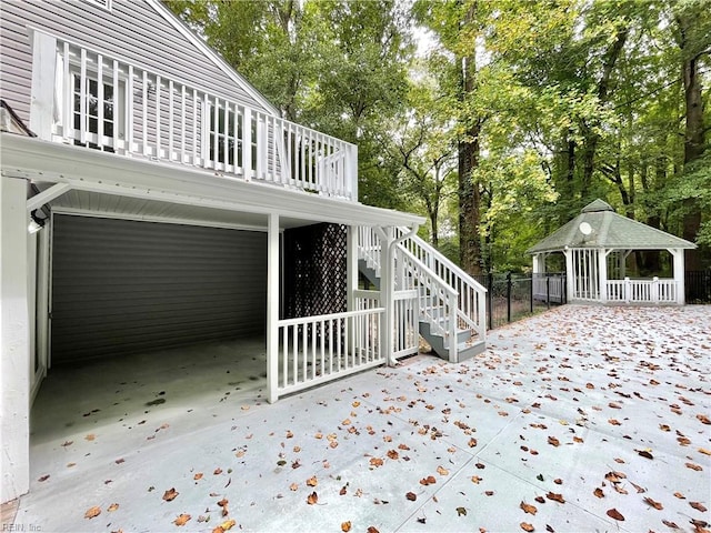 view of side of property with a patio area and a gazebo