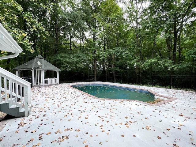 view of pool featuring a gazebo and a patio