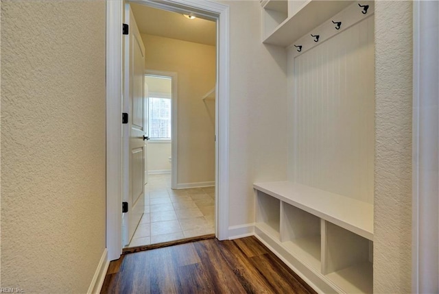 mudroom with wood-type flooring