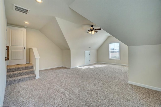 bonus room featuring lofted ceiling, ceiling fan, and light colored carpet