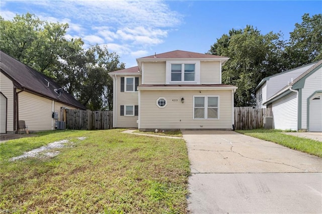 front facade featuring a garage and a front yard