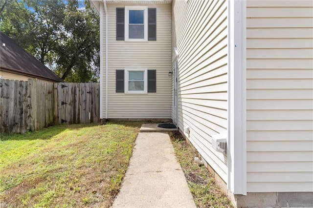 view of property exterior featuring a lawn