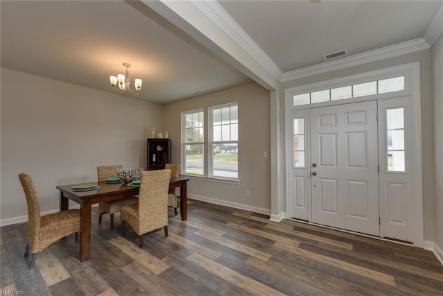 interior space featuring a notable chandelier, crown molding, and dark wood-type flooring