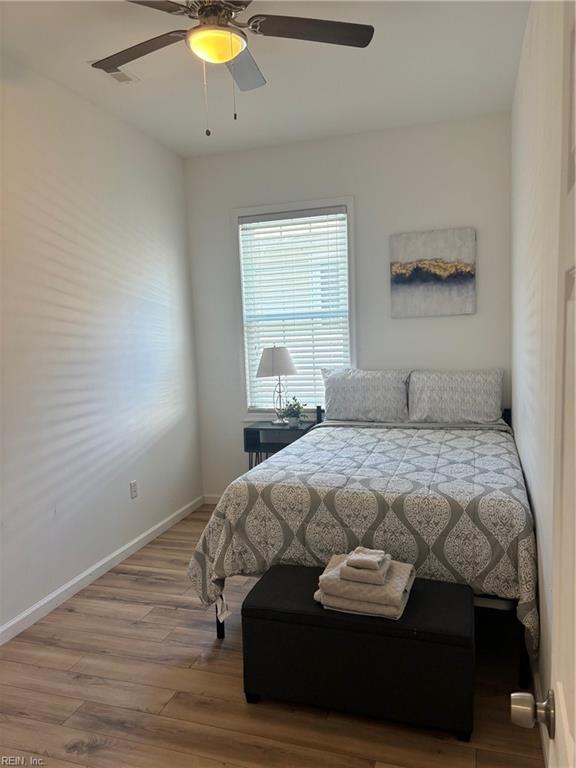 307 N First St, Hampton, VA 23664 - bedroom featuring wood finished floors, a ceiling fan, and baseboards