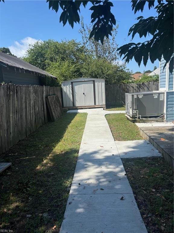 307 N First St, Hampton, VA 23664 - view of yard featuring a fenced backyard, an outbuilding, and a shed