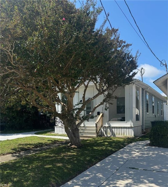307 N First St, Hampton, VA 23664 - view of side of home featuring a lawn