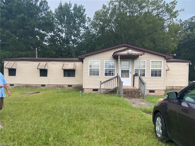 view of front of home with a front yard