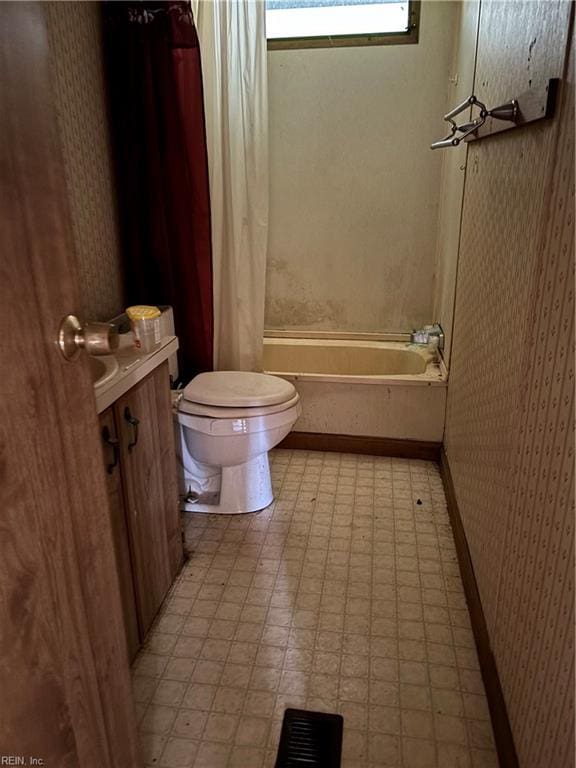 full bathroom featuring shower with separate bathtub, vanity, and toilet