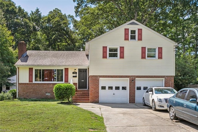 tri-level home featuring a garage and a front lawn