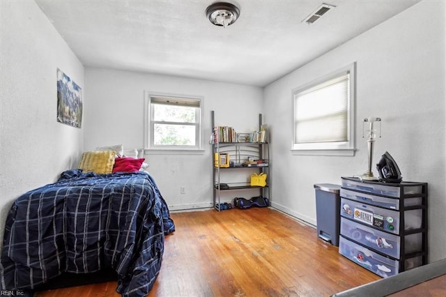 bedroom with hardwood / wood-style floors