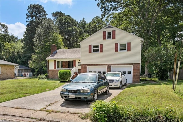 tri-level home featuring a front yard and a garage