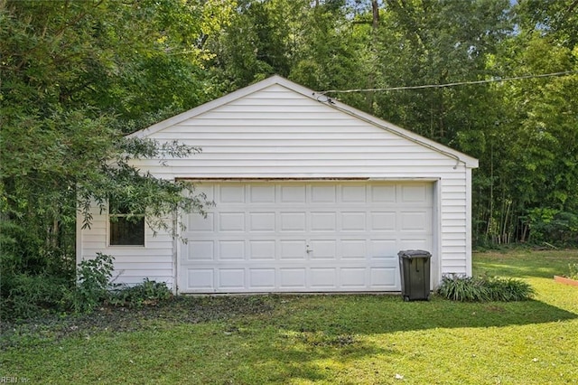 garage featuring a yard