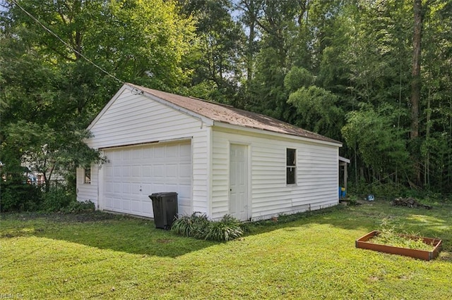 garage featuring a yard