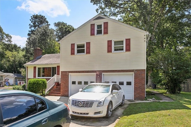 view of front facade with a garage and a front lawn