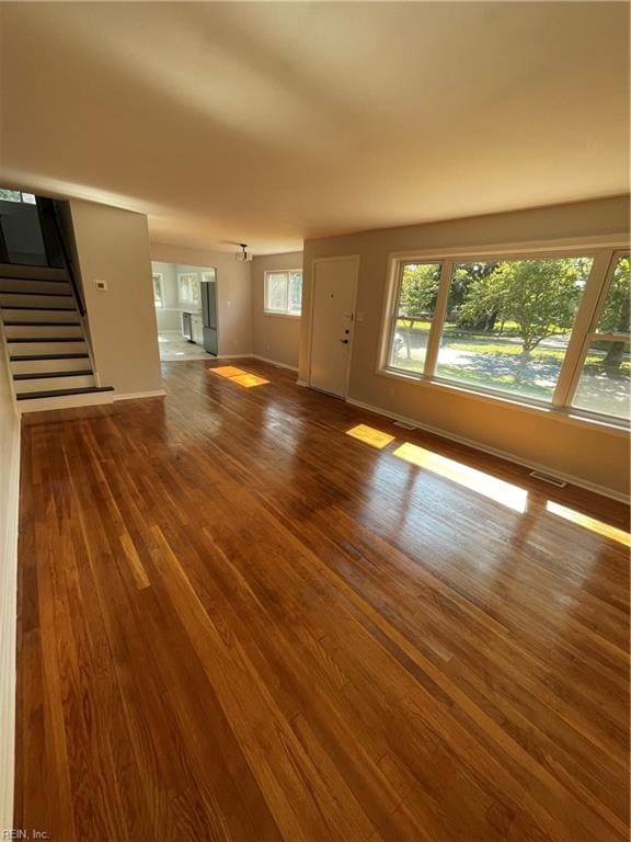 unfurnished living room featuring hardwood / wood-style floors