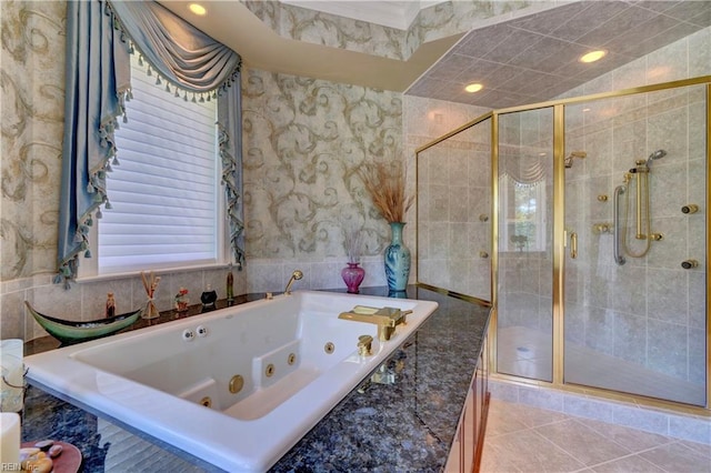 bathroom featuring separate shower and tub, tile walls, and tile patterned flooring