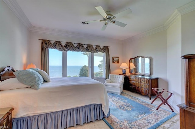 carpeted bedroom with ceiling fan, ornamental molding, and a water view