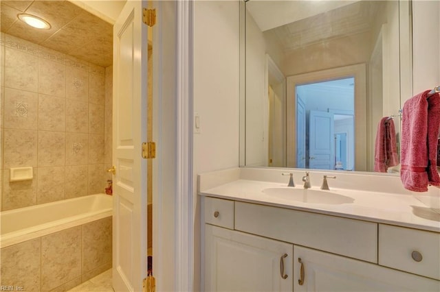 bathroom with vanity and a relaxing tiled tub