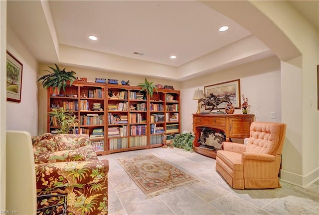 sitting room featuring a tray ceiling