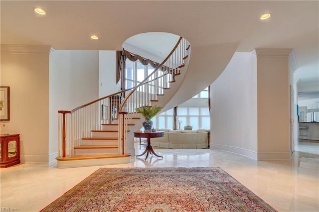 stairs featuring crown molding