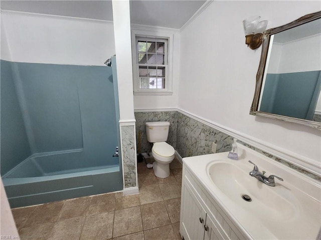 full bathroom with bathing tub / shower combination, vanity, toilet, and ornamental molding