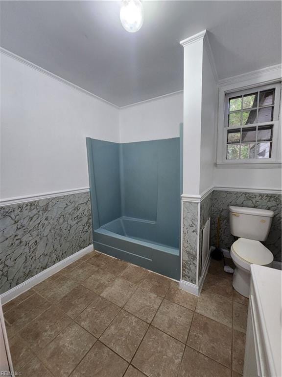 bathroom featuring ornamental molding, tile walls, vanity, and toilet