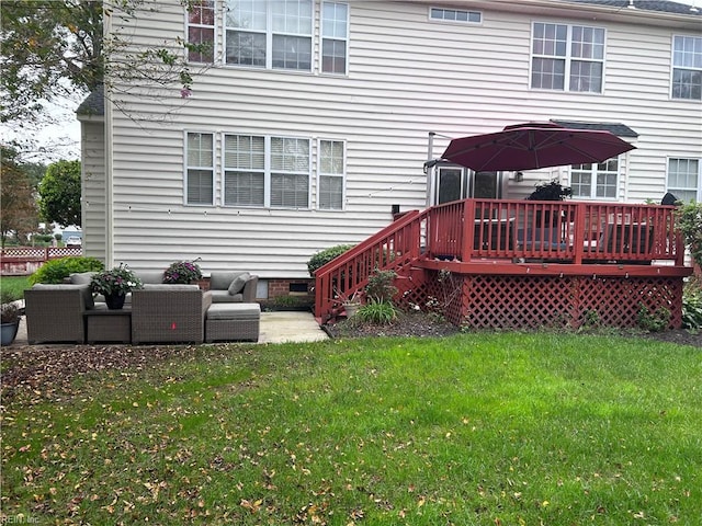 rear view of property featuring a lawn, a wooden deck, and an outdoor living space