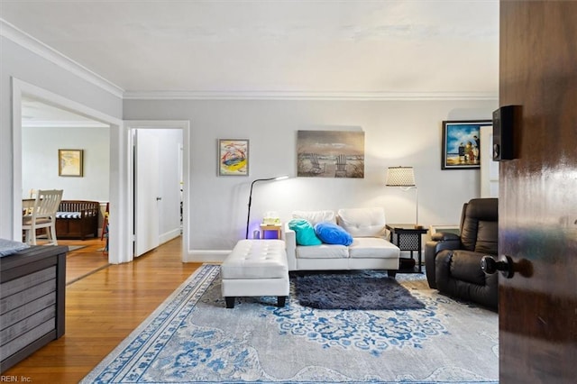 living room featuring ornamental molding and hardwood / wood-style flooring