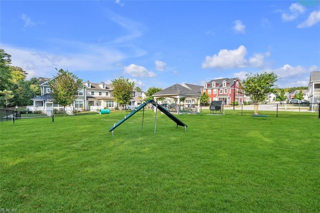 view of community featuring a lawn and a gazebo