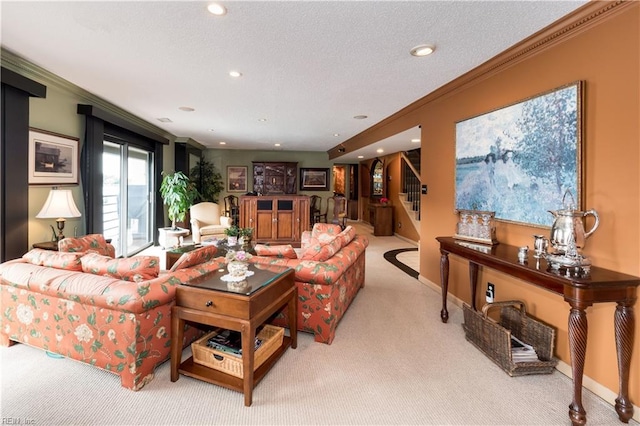 living room featuring light carpet, a textured ceiling, and ornamental molding