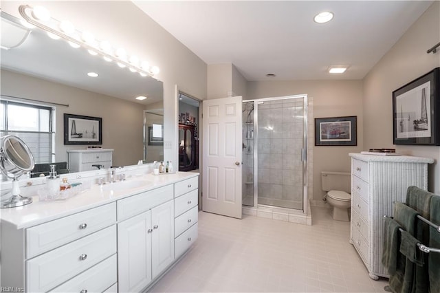 bathroom featuring walk in shower, vanity, and toilet