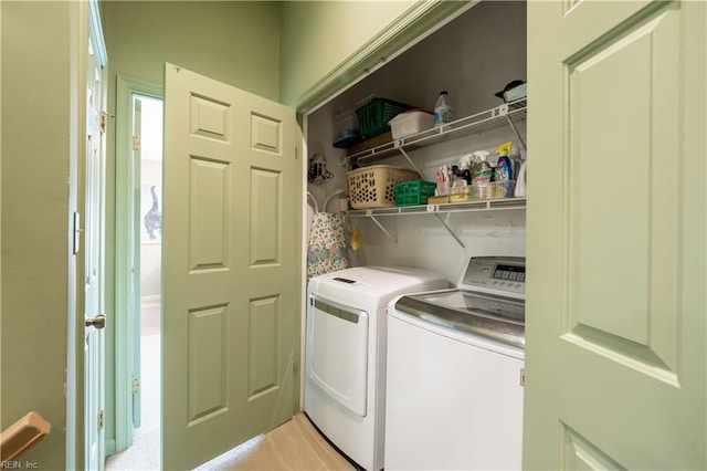 washroom featuring washing machine and dryer