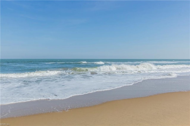 view of water feature with a beach view