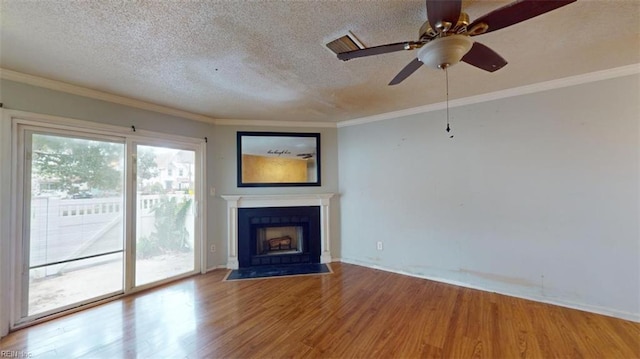 unfurnished living room with ceiling fan, crown molding, hardwood / wood-style floors, and a textured ceiling