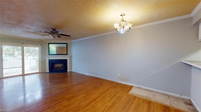 7 Tamarisk Quay Quay Unit 7B, Hampton, VA 23666 - unfurnished living room featuring ornamental molding, a textured ceiling, a fireplace with flush hearth, ceiling fan with notable chandelier, and wood finished floors