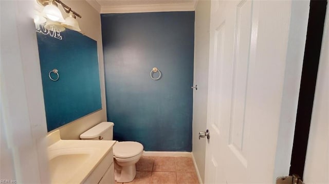 bathroom featuring ornamental molding, tile patterned floors, vanity, and toilet