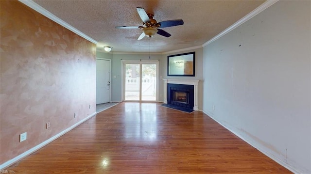 7 Tamarisk Quay Quay Unit 7B, Hampton, VA 23666 - unfurnished living room with crown molding, a ceiling fan, wood finished floors, and a textured ceiling