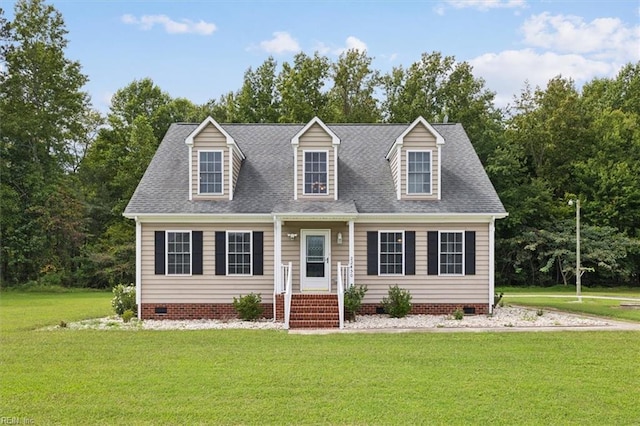 cape cod-style house featuring a front yard