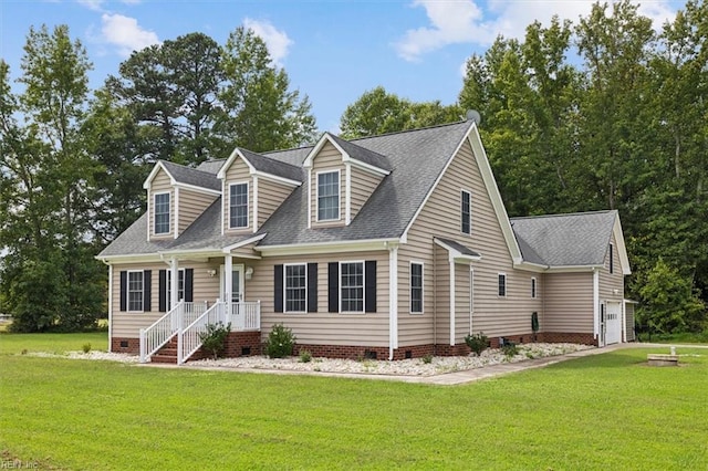 cape cod home featuring a front yard and a garage