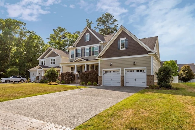 craftsman-style house with a garage and a front lawn