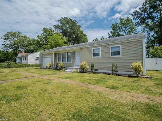 view of front of property featuring a front lawn and a garage