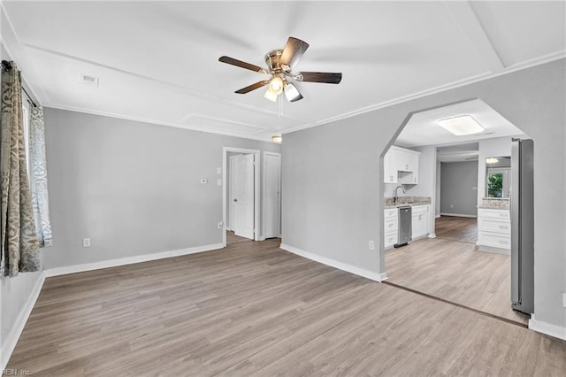 unfurnished living room with light hardwood / wood-style flooring, ceiling fan, ornamental molding, and sink