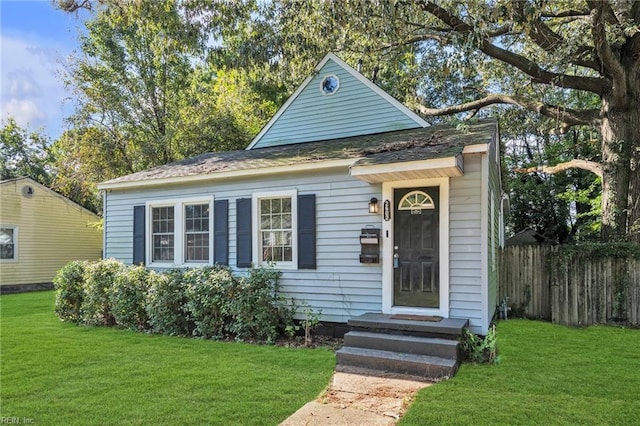 bungalow with a front yard