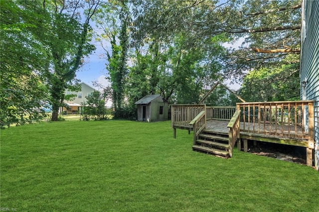 view of yard with a storage shed and a deck