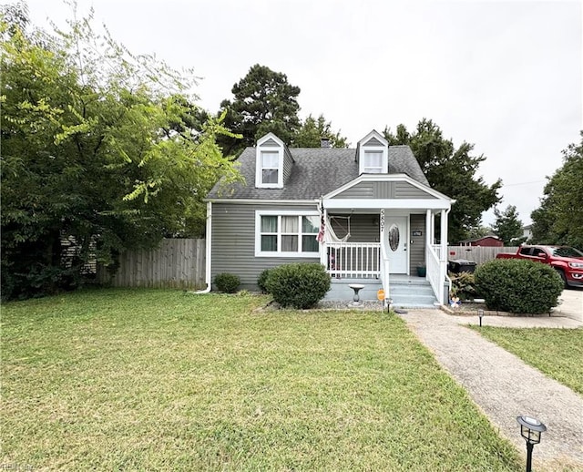 cape cod house featuring a front lawn and a porch