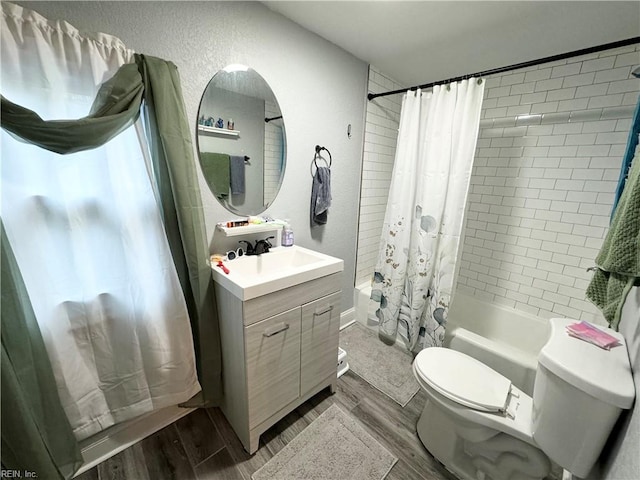 full bathroom with shower / bathtub combination with curtain, wood-type flooring, vanity, and toilet