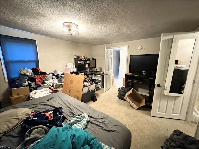 carpeted bedroom with a textured ceiling